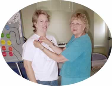 Alice Hockaday being pinned by Mentor Dottie Graham