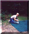 Becki after the first night on the trip putting the tent away