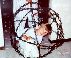 Christopher sitting in a sphere?)
