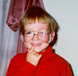 Christopher with Mom's glasses on