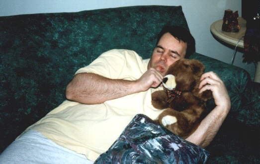Our hero rests with his favorite teddy bear - Freddie after a long night from working on webpages.