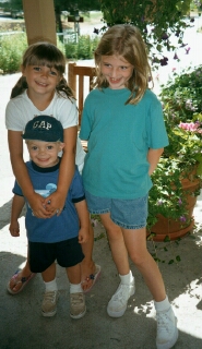 Hannah, Evan, and Julia outside the lodge