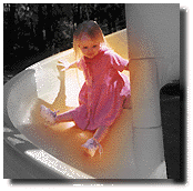 [Ellen on a yellow slide]