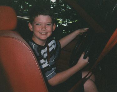 Johnny driving Dad's car