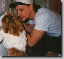 Piper standing on hind legs looking out the window with Daddy. (Spring 97 7K)