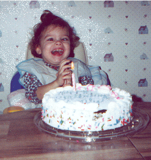 Emily in Booster Chair on 3rd Birthday