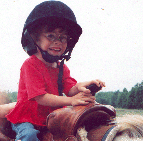 Emily riding horse at Therapeutic Riding Stable