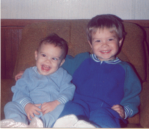 Emily and Jimbo sitting in chair together
