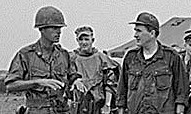 A Marine platoon leader talks with Governor John H. Chafee (R-RI) in Vietnam.