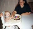 This Is Sabrina (2nd Daughter) Trying To Grab Her Cake While Being Held Back By Her Mom Summer (My Wife) While Everyone Was Singing Happy Birthday At Her 1st Birthday Party At Her Grandpa Buddy's (Summer's Dad, My Father In Law) House In 1998!