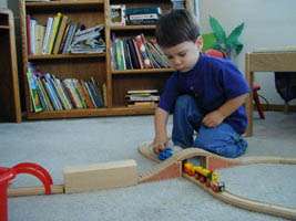 Playing with his trains. [21,786 bytes]