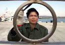 A Taiwanese worker paints a railing at a harbor on the Taiwanese frontline island of Kinmen, December 28, 2000 as the island prepares for the resumption of direct links with mainland Chinese ports.(Simon Kwong/Reuters)