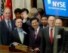 China's Vice President Hu Jintao, center, waves from the bell podium at the New York Stock Exchange Monday, April 29, 2002, in New York before ringing the opening bell. (AP Photo/Kathy Willens) 