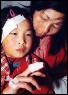 Twelve-year-old Song Xiaohong is embraced by her mother. Song survived a powerful explosion at his elementary school on March 6 in Wanzai County, East China's Jiangxi Province. At least 41 people, most of them children were killed in the blast. China's Ministry of Public Security officers are investigating the explosion - Chinadaily (Reuters photo)