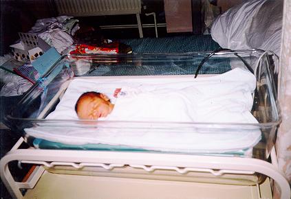 Nathan in a phototherapy unit with a special suit on