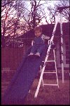 Jeffrey in the backyard on his slide. 1-99