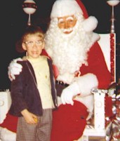 Doug standing with Santa 1969