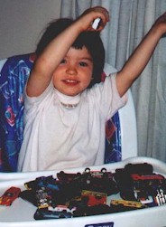 Haley with her matchbox cars