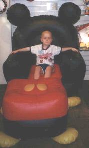 in a Mickey Mouse chair