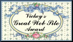 Vicky's Great Web Site Award on patterned background and flowers