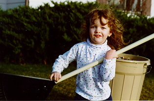 That's a tall rake for a short kid!