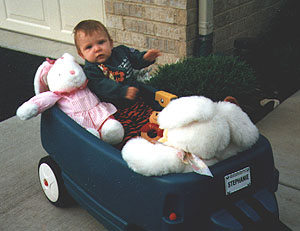 Stephanie in her wagon September, 1996