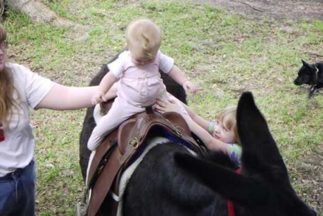 Elizabeth on BeBe, with Mommy and Kasey helping out