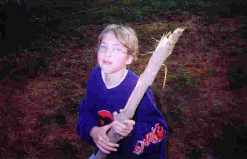 Gus earned his Whittling Chip and practiced on this stick