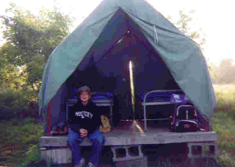 Gus arrived at camp late after having to go to a doctor appointment.  Sean met Gus at the gate, said, 'You're my tent partner,' and showed him to their tent.