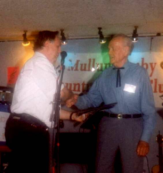 Kevin Swanton shaking Ron Peters hand