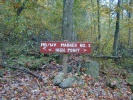 A sign pointing the way to the top