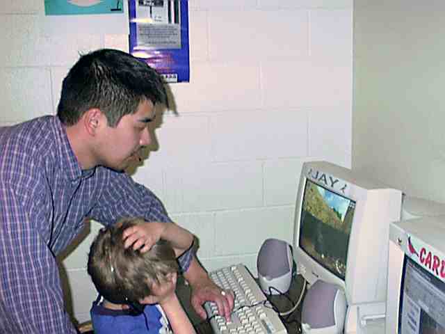 Nori is helping a student navigate the software.