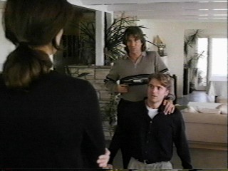 Eric holding gun on Natale