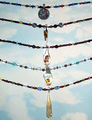 Pendants by F &  H Custom Glass, beadwork by Janice Boling.