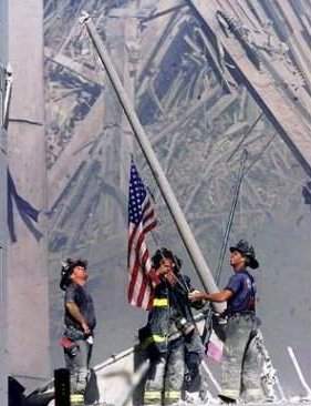 firemen raising flag