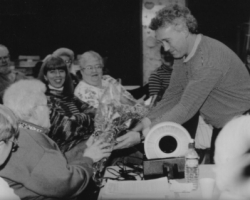 Mark Whitfield presenting Carrie with flowers