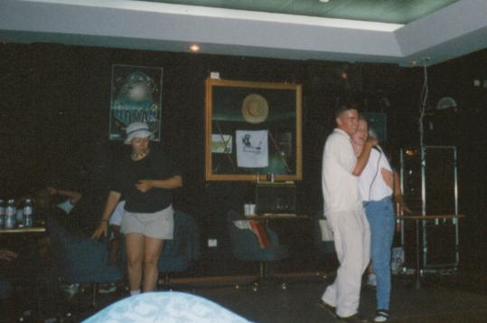 This is me at Karaoke night at a bar on base.  I don't know the girl i was singing with or the girl that's giving me a once over as she stands up.   :)