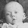 11356 - baby on mother's lap, taken at Auckland