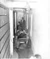 Early 1960's cell Sheriff hughes in background.jpg (61394 bytes)