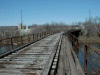 An interesting bridge near a canal towpath.