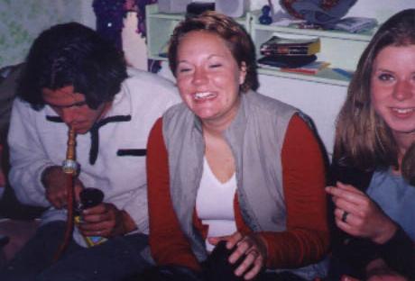 Landy from .de smokin a hookah while Pernille from .dk cracks up and her friend Henriette gets cut off by the photographer