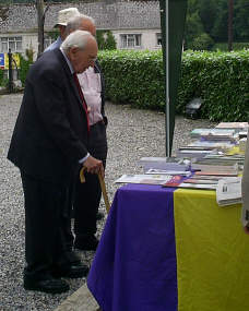 Jack checking if the bookstall had copies of his biography, 
