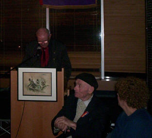 

Michael O'Riordan observed by Bob Doyle, the man with the hat and the cane.