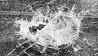 Bullet got lodged in a 5.5 mm. thick triplex glass.
