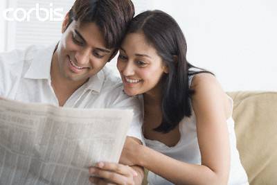 indian couple cute reading newspaper creame light beigh couch sofa loveseat love seat white polo button down shirt side short man's hairstyle young woman straight hair smiling clean teeth dentist rani mukerji kareena kapoor sharukh kahn jennifer lopez eye brow thread bikini wax