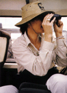 Pictured here surveying the Kenyan countryside from a jeep