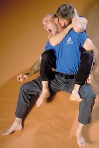 Small bites: With his hooks (feet) planted, Paul Vunak secures the head of opponent Jeff Clancy and nips his neck. Vunak says one of the essentials of kino mutai is to not bite off more than you can chewliterally.