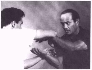 Dan Inosanto performing Chi Sao