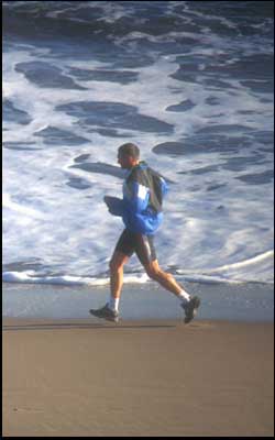 A man running on the beach!