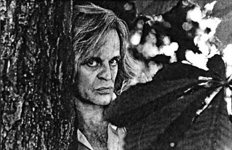 Kinski Behind Tree (43KB)